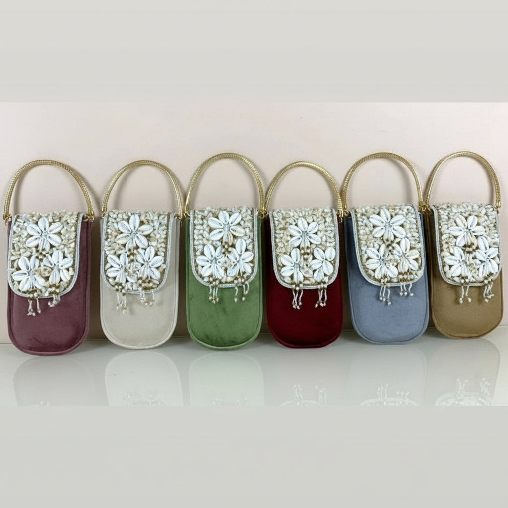 Woman in traditional attire holding a decorative phone case against a brown background